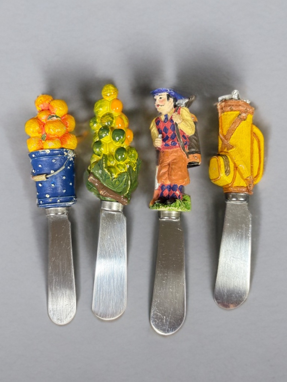 Boston Warehouse novelty cheese spreaders.